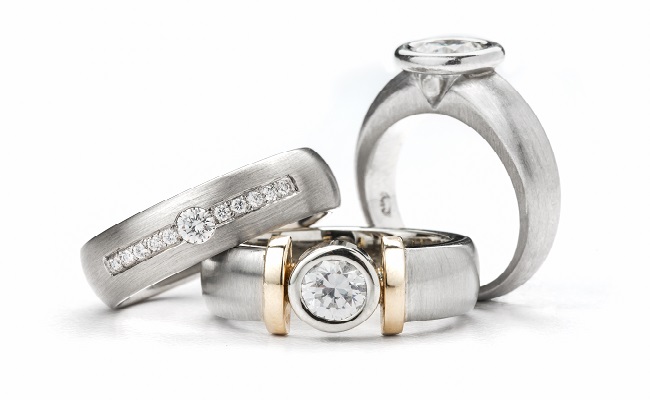 Bezel-set diamond rings with satin texture
