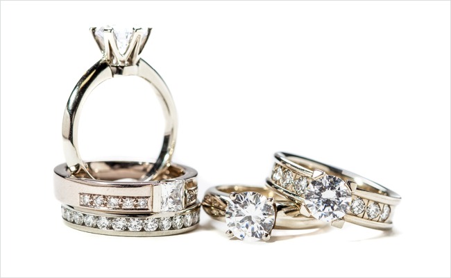 White gold and diamond solitaire rings and wedding bands