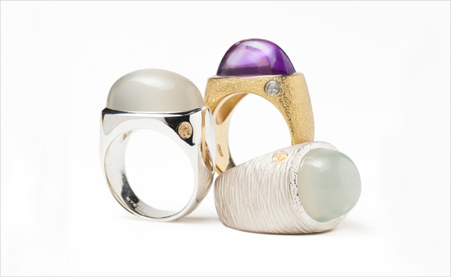 Three cabochon rings, available in white gold, yellow gold and silver