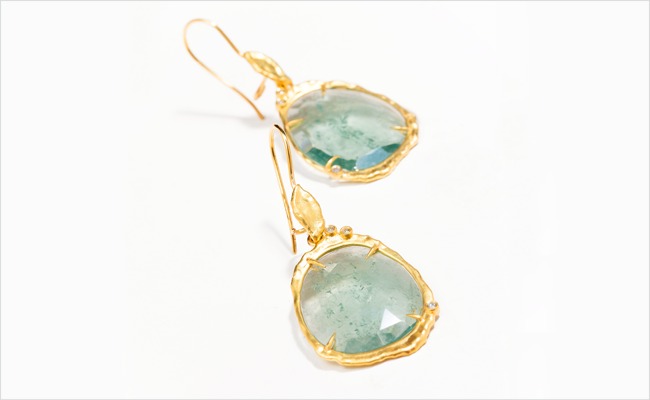 Green tourmaline slice earrings with diamond accents, set in 18k yellow gold