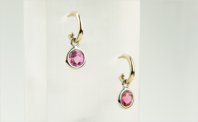 Gold hoops with pink spinel enhancers