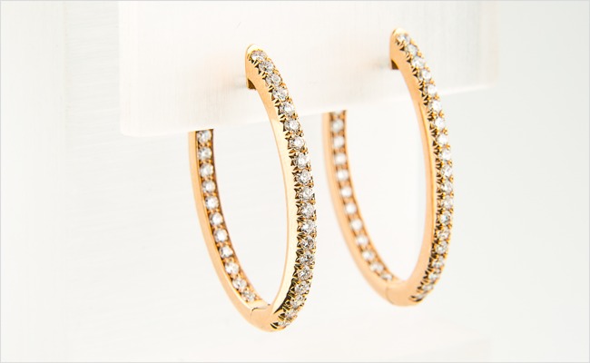 Large rose gold hoops, with diamonds on the inner and outer edges