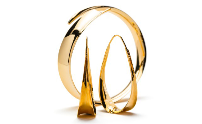 18K gold bangle with anticlastic curvature design, shown with matching earrings