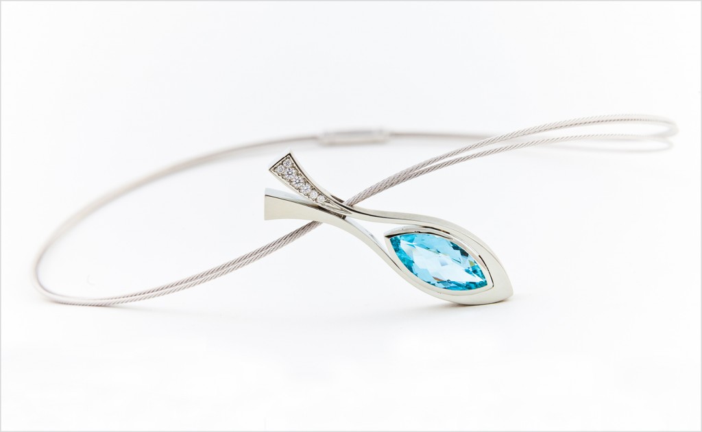 Marquise-shaped blue topaz pendant accented with diamonds