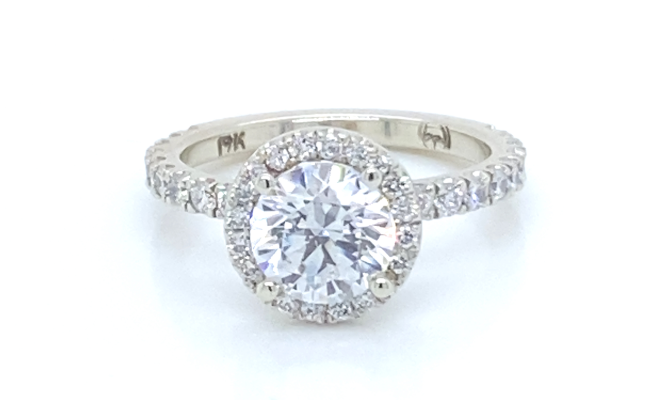 Diamond halo ring in 19K white gold set with 48 diamonds of VS clarity and EF colour.